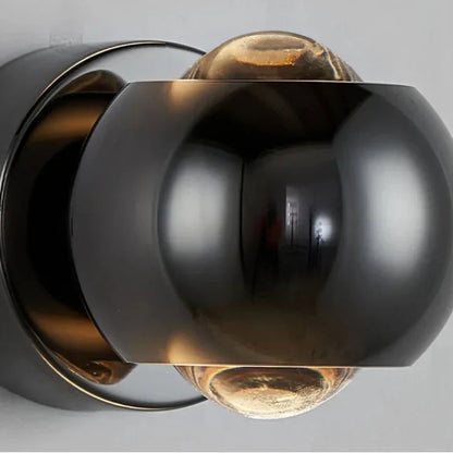 Orbis LED-wandlamp – draaibare bolvormige lamp in zwart met 360° lichtuitlijning